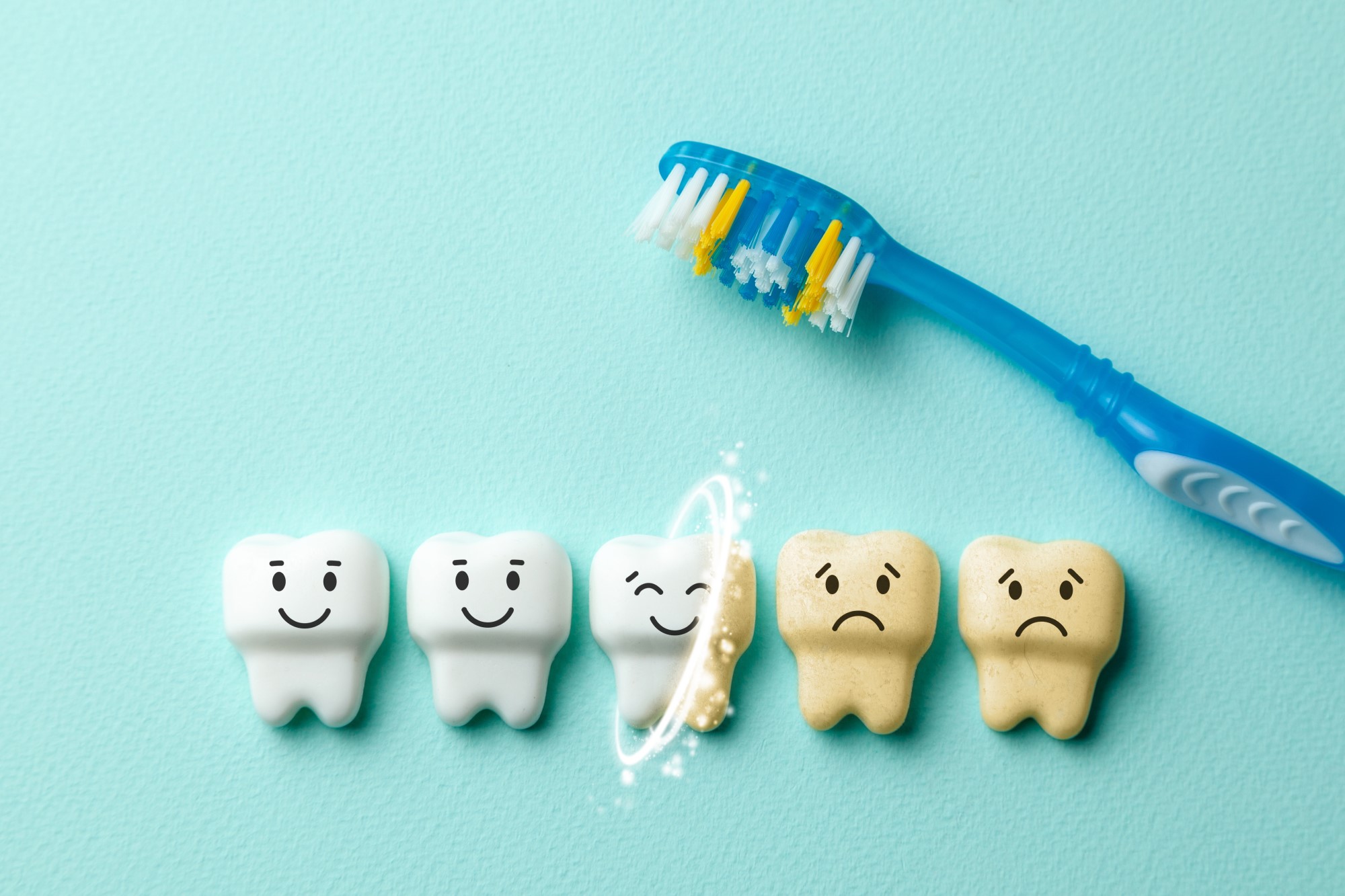 Toothbrush making teeth whiter and scrubbing off coffee stains