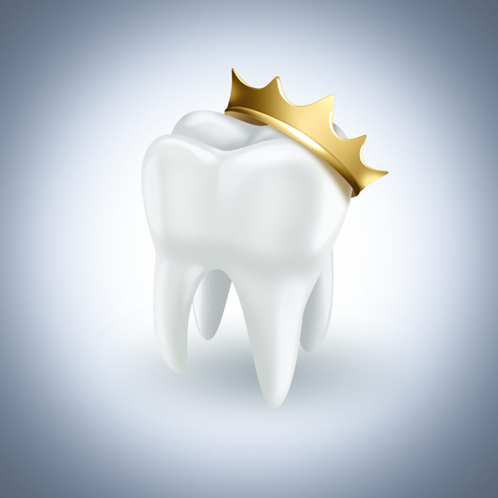 tooth with gold crown on light background