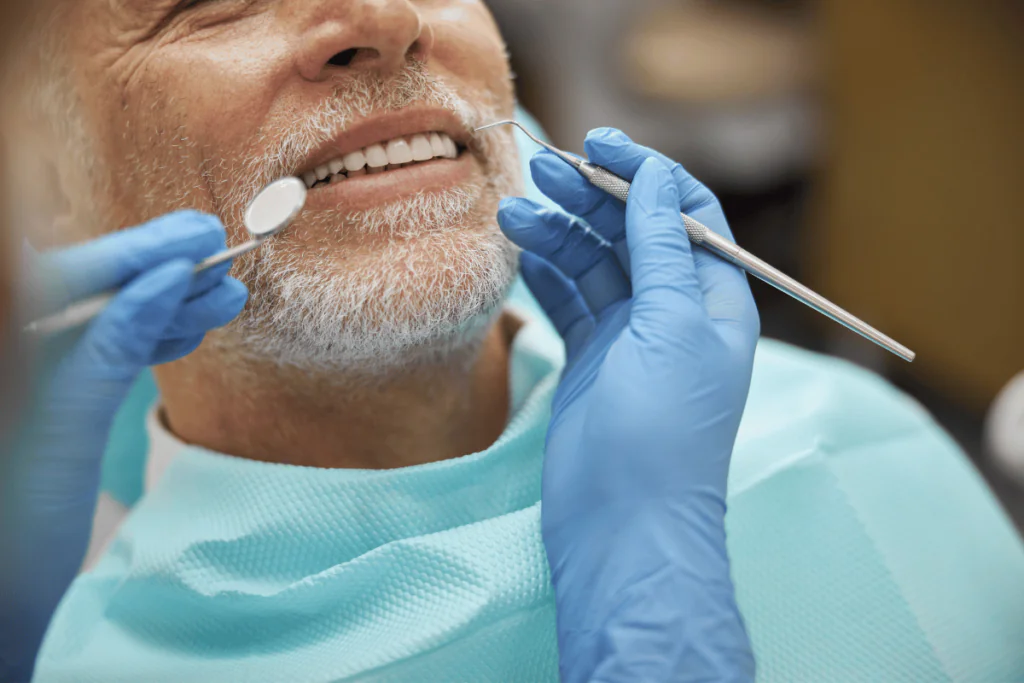A man receiving a routine dental exam
